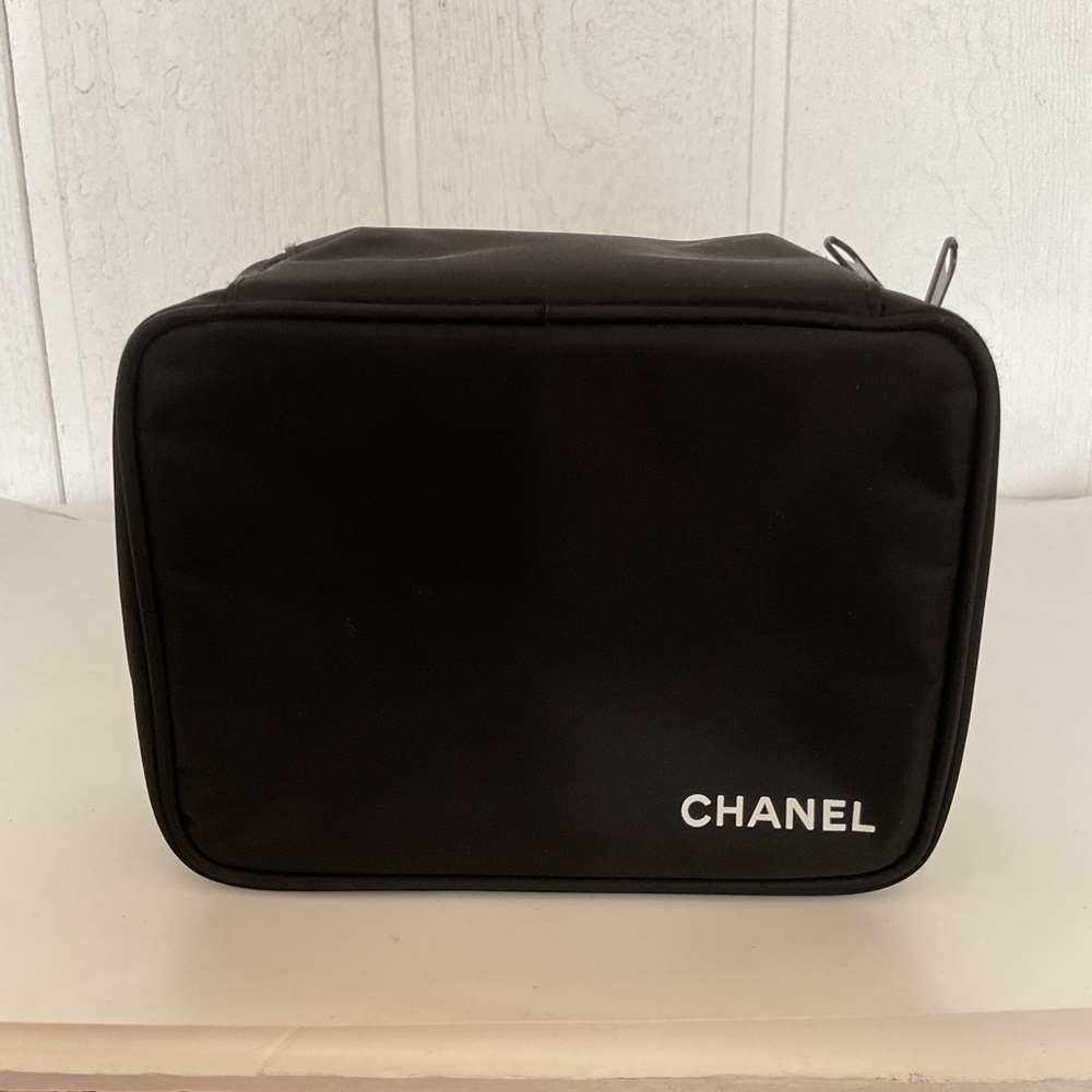 CHANEL black zippered cosmetic bag. NWOT